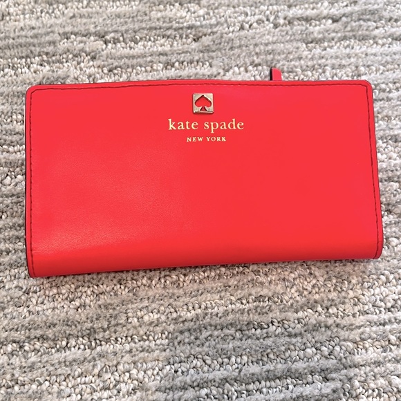 kate spade Handbags - Kate Spade Large Slim Bifold Wallet Red and Pink
